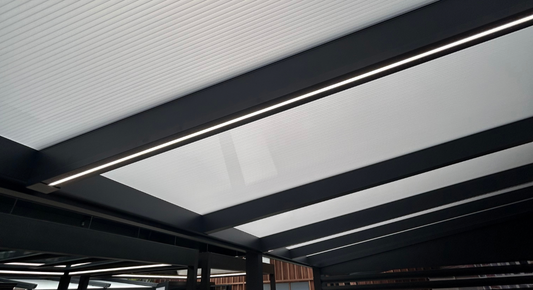 LED strip lighting installed in a veranda beam, warm white 2700K glow along the rafter