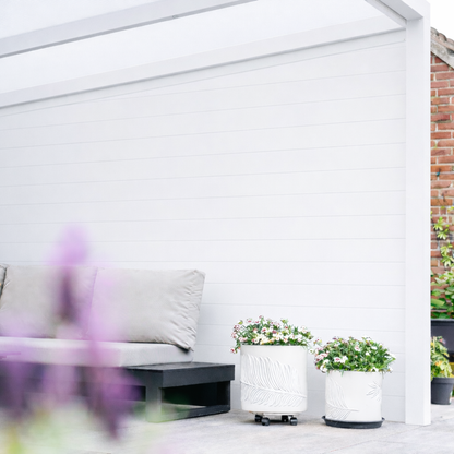 Roma Pannello panels in anthracite as a raised planter surrounding a terrace garden bed