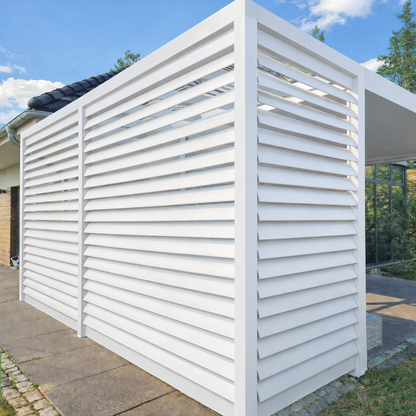Rotatable aluminium louvre panel in cream installed on a garden veranda side