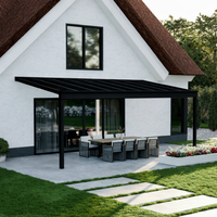 Pigato Plus veranda in anthracite from garden showing glass roof and slim post profile