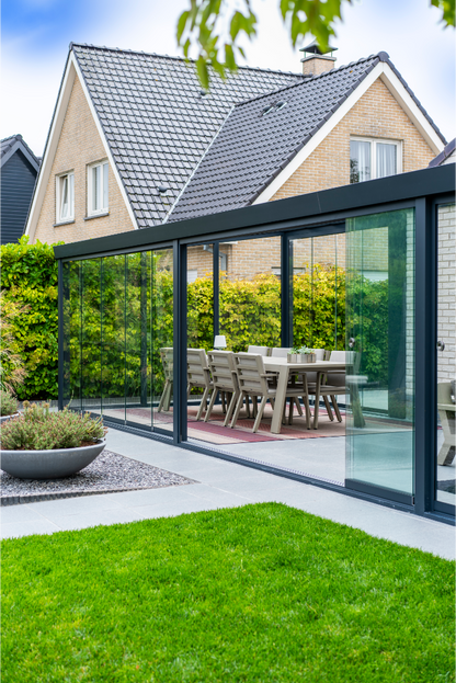 Roma Primo frameless glass doors on a glass roof veranda, full-width enclosure