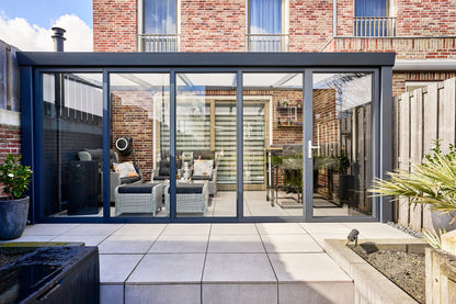 Roma Vista glass door system on a large veranda, complete facade open in sunshine
