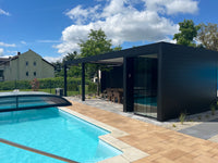 Pinela Deluxe Plus pergola in anthracite wall-mounted, panels partially retracted overhead