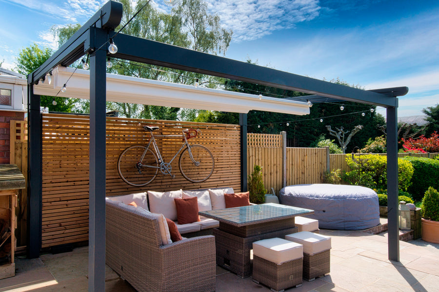 Aluminium Folding Roof Veranda | The Libero | Retractable Waterproof Fabric Roof | Integrated LED | Concealed Drainage Through Posts