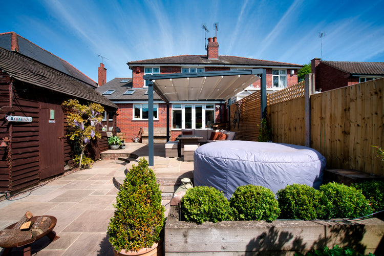Aluminium Folding Roof Veranda | The Libero | Retractable Waterproof Fabric Roof | Integrated LED | Concealed Drainage Through Posts