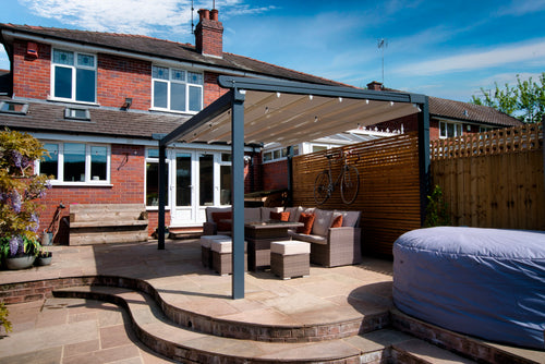 Aluminium Folding Roof Veranda | The Libero | Retractable Waterproof Fabric Roof | Integrated LED | Concealed Drainage Through Posts