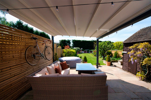 Aluminium Folding Roof Veranda | The Libero | Retractable Waterproof Fabric Roof | Integrated LED | Concealed Drainage Through Posts
