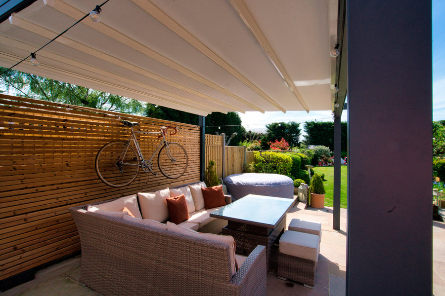 Aluminium Folding Roof Veranda | The Libero | Retractable Waterproof Fabric Roof | Integrated LED | Concealed Drainage Through Posts