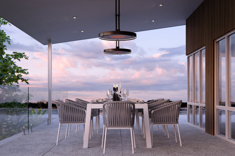 Bromic Eclipse Smart-Heat Electric on a twin pole above a garden dining table | Roma Verandas
