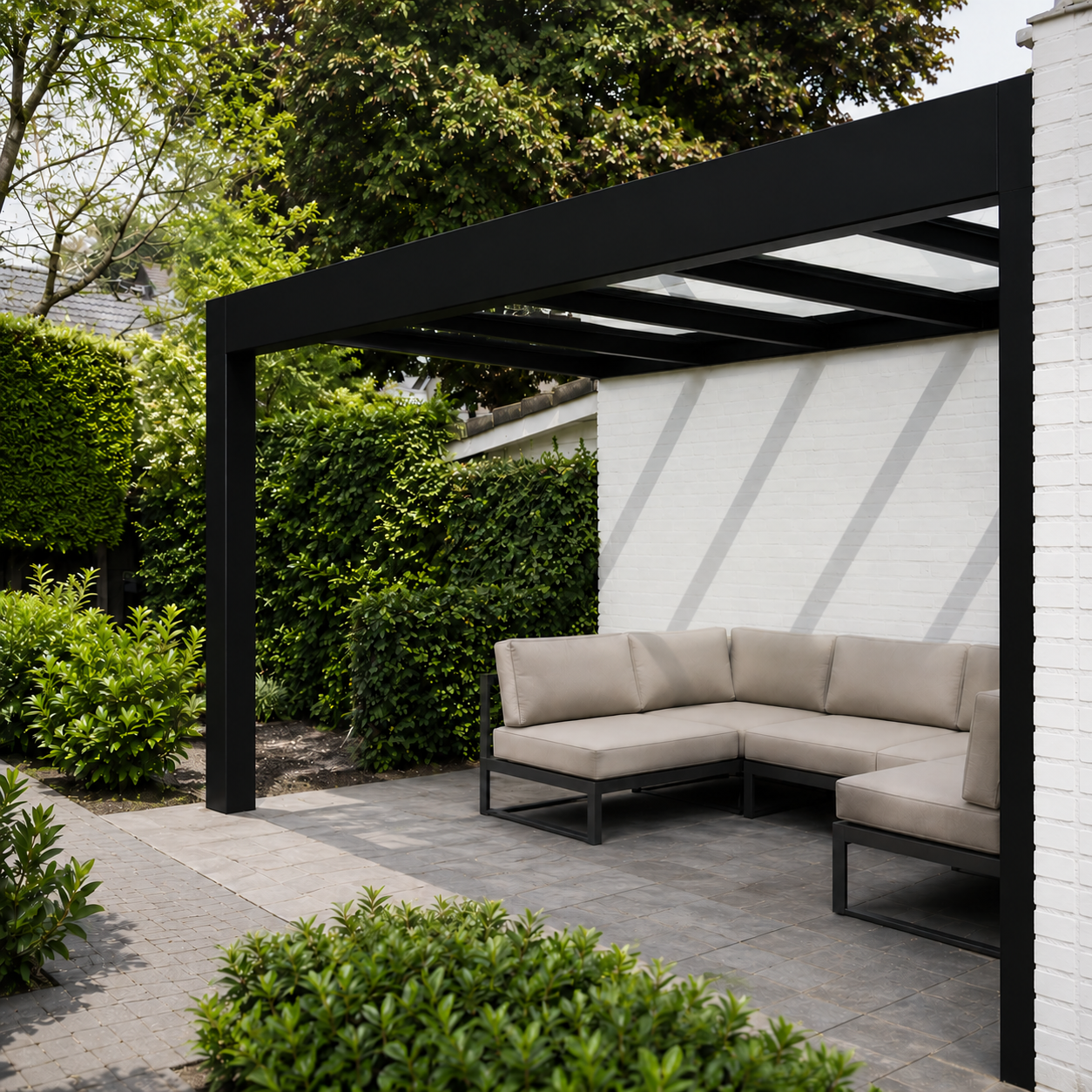 Trebbiano veranda in white on a rendered home, flat glass roof from garden perspective