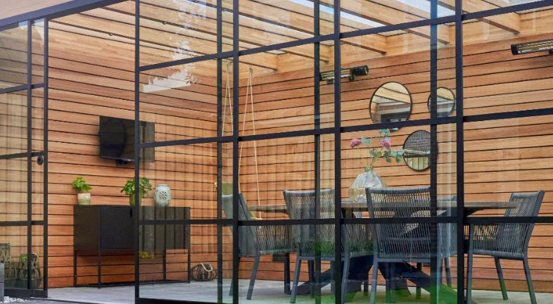 Steel look glass door panel in anthracite on a veranda, garden room effect