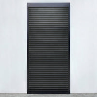 Louvred sliding door panel in anthracite with black slats, installed on a veranda side
