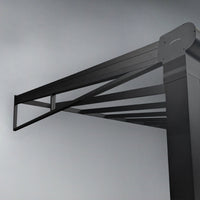 Glass veranda gable panel in black frame close-up of safety glass and frame edge