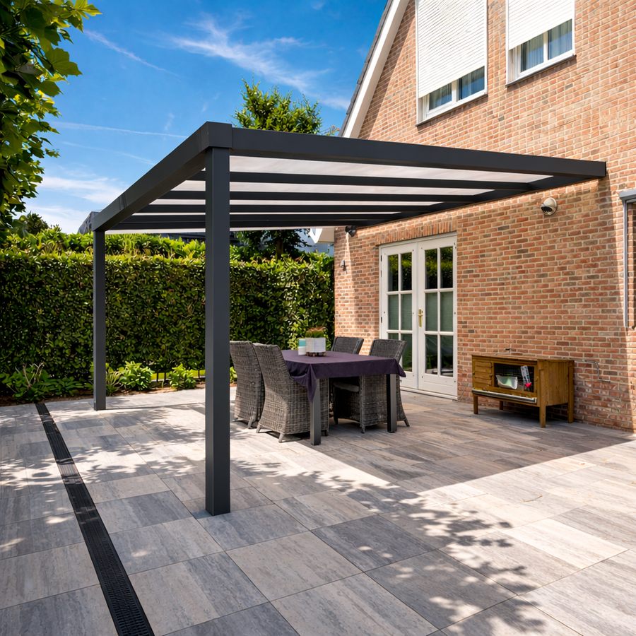 Giallo Plus glass veranda in anthracite at dusk, LED lighting active along the gutter