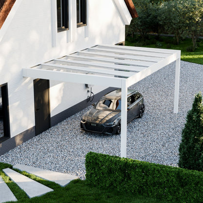 The Rimessa glass roof carport in anthracite from garden at dusk