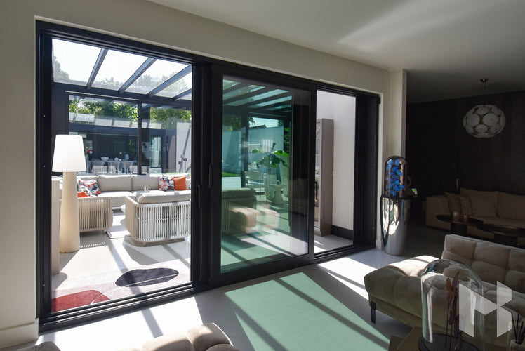 MB Glass Sliding Walls by Roma Verandas - glass door system black opened cube