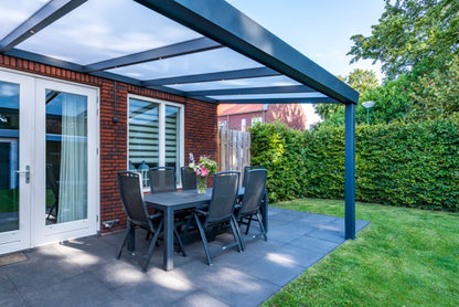 The Luxa veranda in white covering a terrace with lounge furniture below