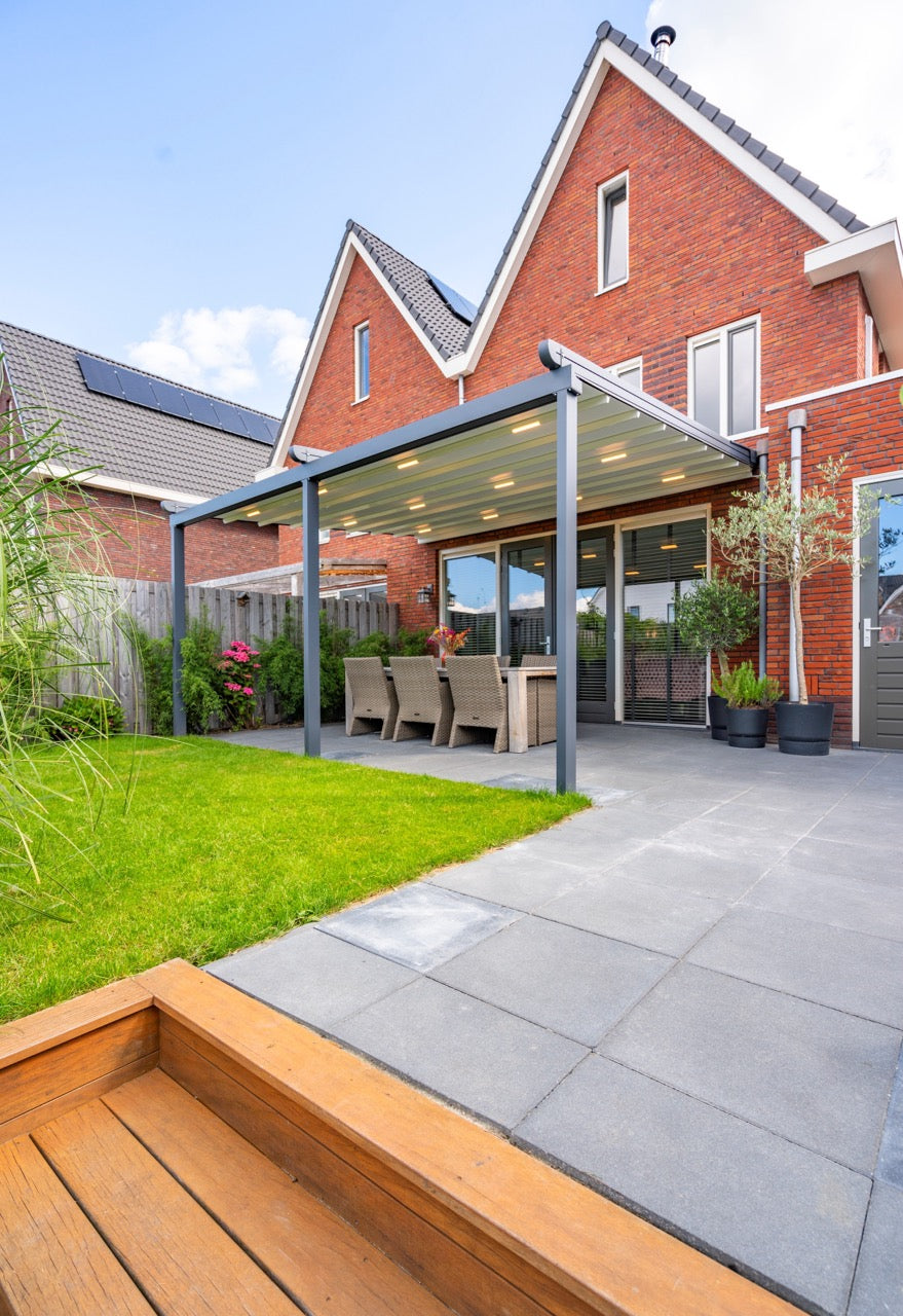 The Libero veranda in anthracite on a rendered modern home, rear elevation