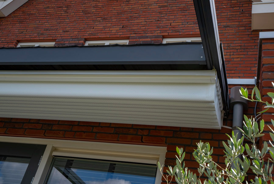 Libero veranda in anthracite from garden at dusk with LED strip illuminating the patio