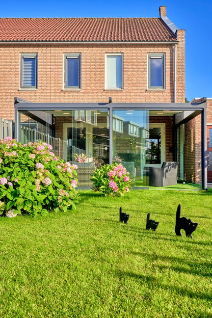Libero veranda in anthracite on a contemporary home, fabric roof retracted fully