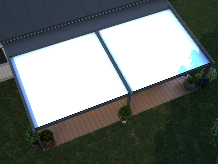 The Libero veranda in anthracite from garden with fabric roof partially retracted