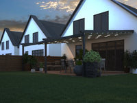 Libero veranda in anthracite at dusk with integrated LED lighting along the beam