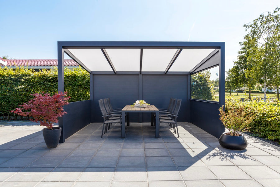 Freestanding Cascina veranda in anthracite positioned away from the house in a garden