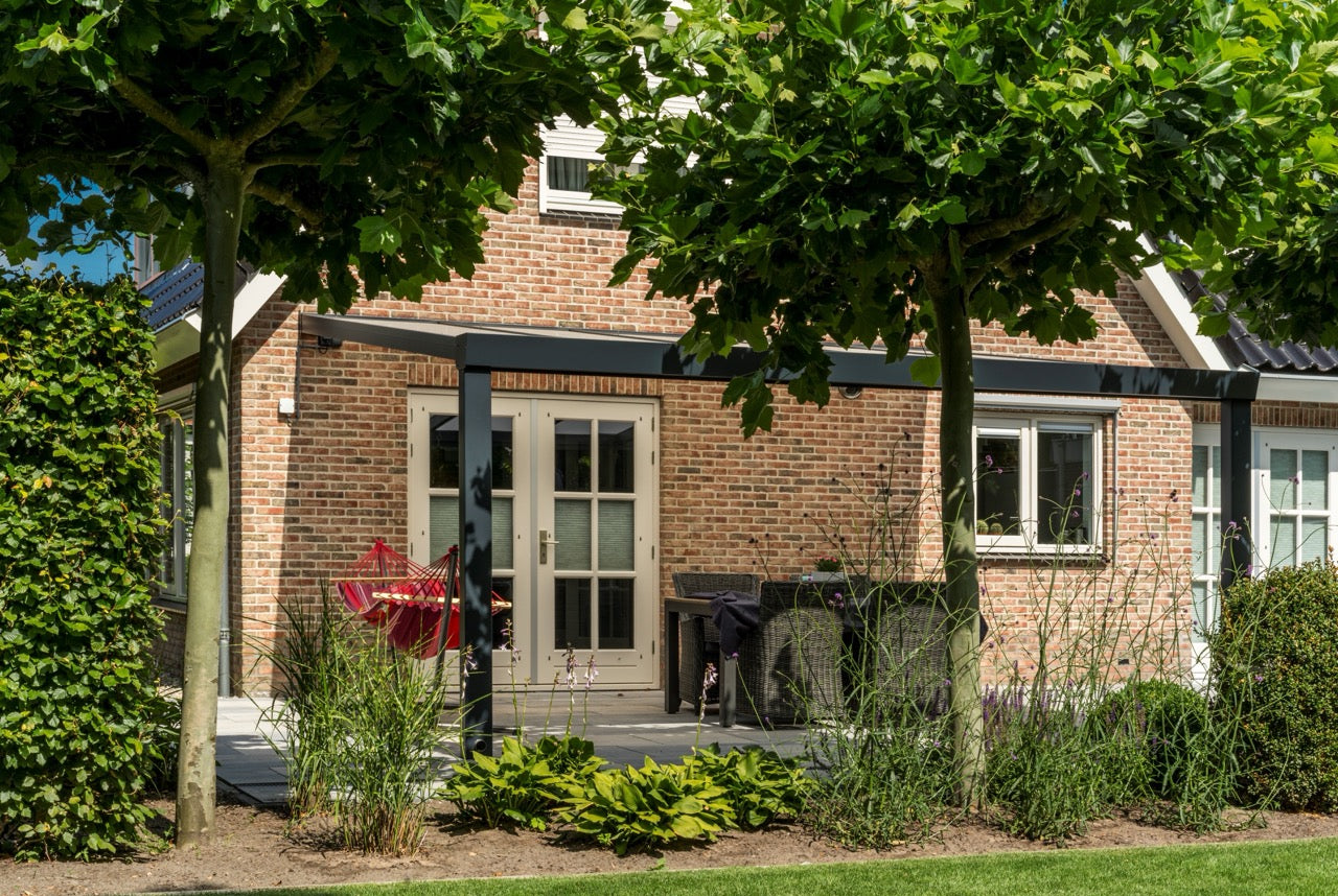Luxa veranda in anthracite at dusk with integrated LED lighting active below