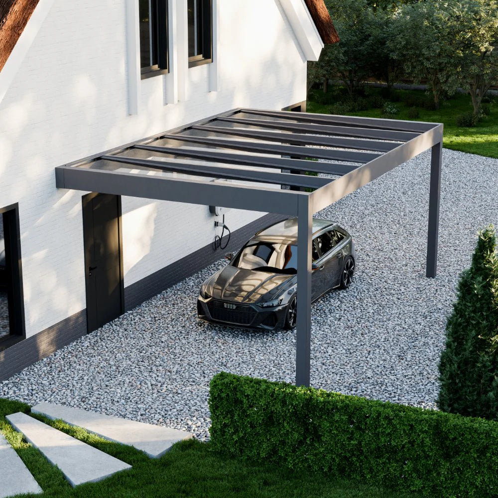 The Rimessa wall-mounted carport in anthracite at dusk, LED lighting active below