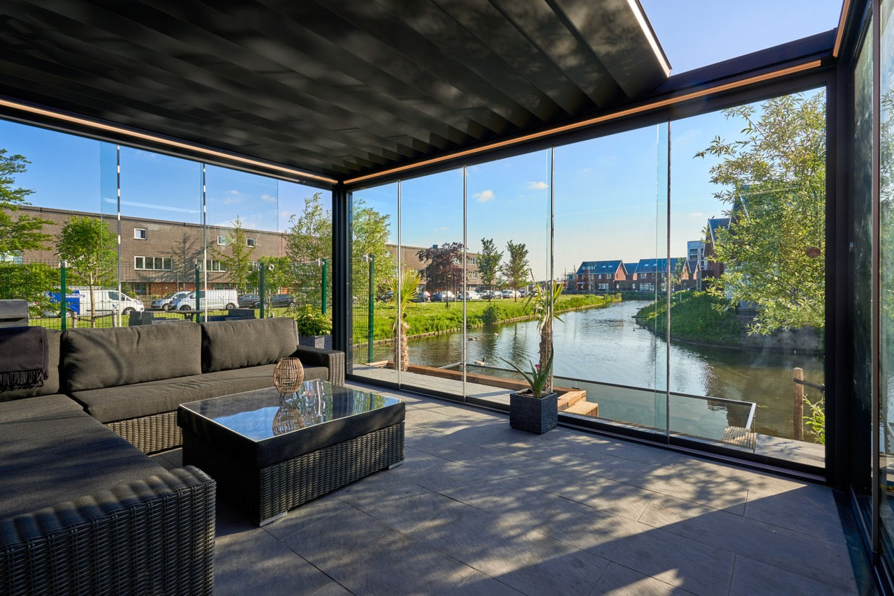 Aperto pergola in anthracite with panels partially open from garden perspective