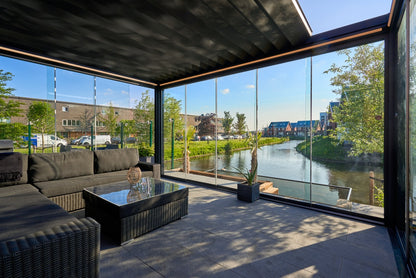 Aperto pergola in anthracite with panels partially open from garden perspective