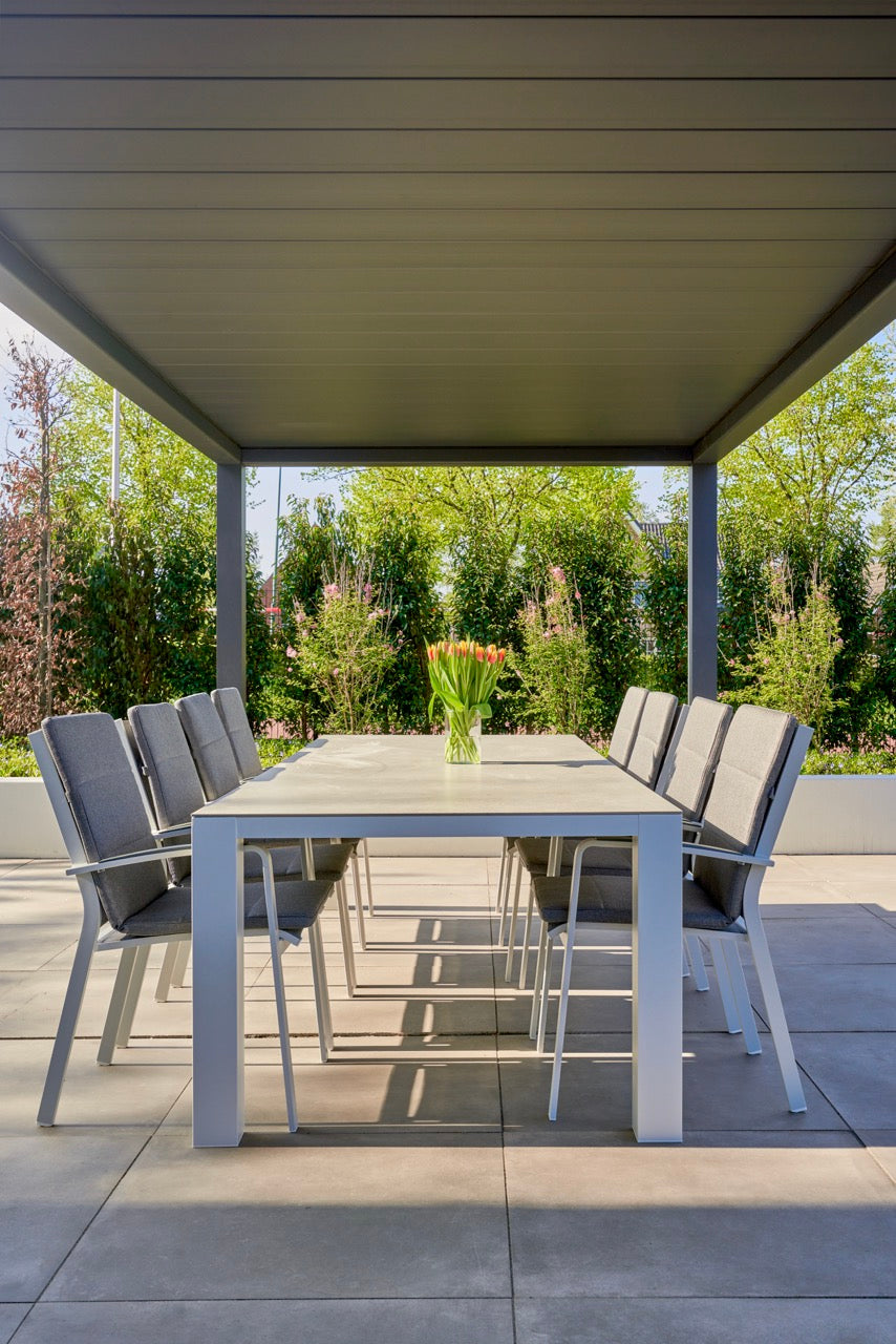 Aperto pergola in white covering a large entertainment terrace, panels open