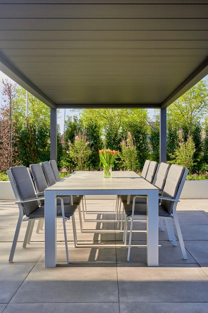 Aperto pergola in white covering a large entertainment terrace, panels open