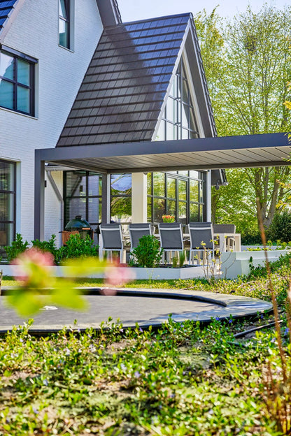 The Aperto pergola in anthracite on a detached home, wide angle from garden