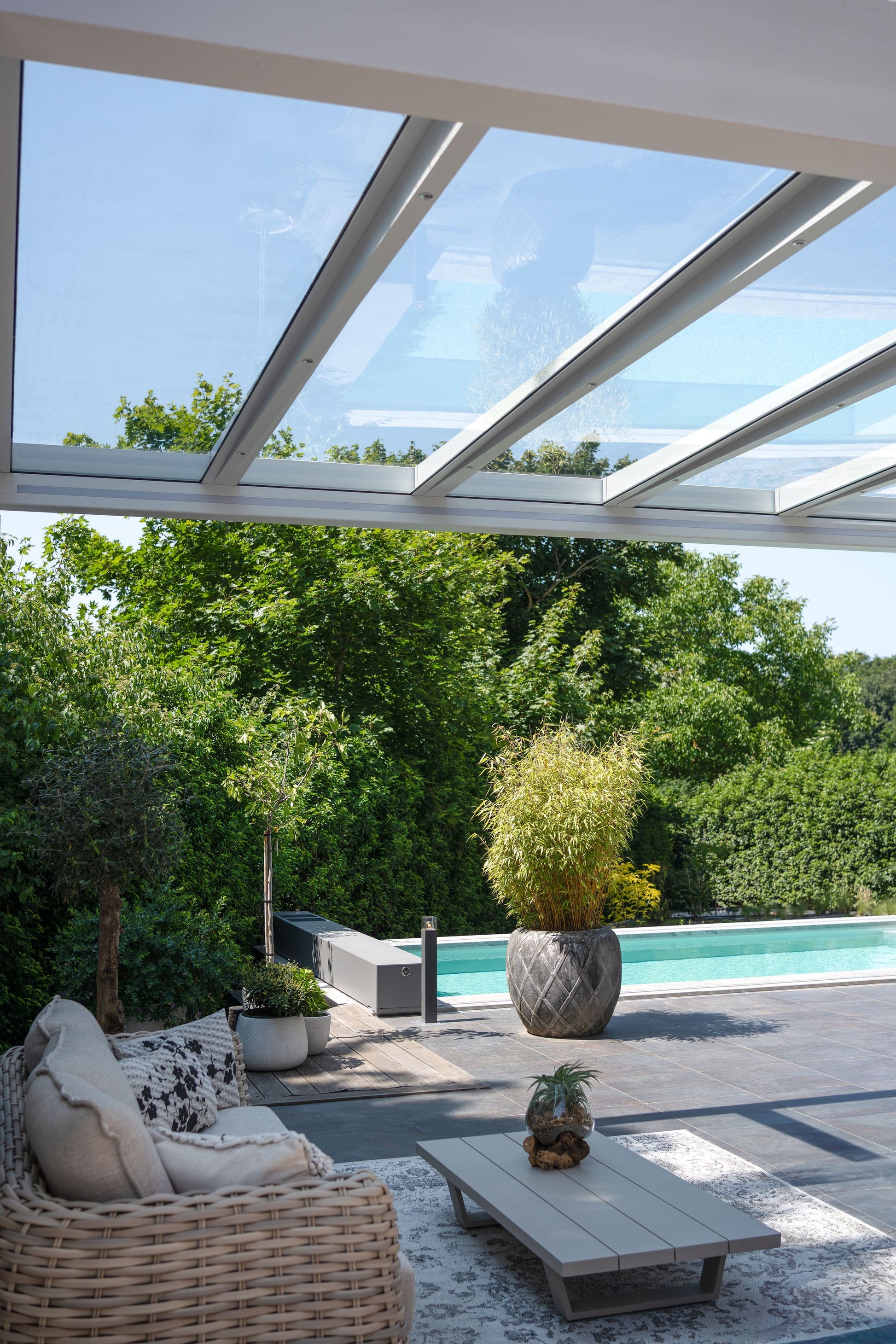 The Cristallo pergola in white on a white render home, rear garden view