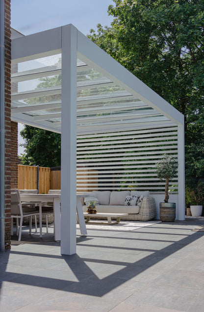 Cristallo pergola in anthracite from garden showing full span on two posts