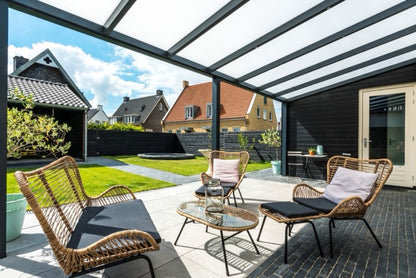Cascina veranda in anthracite showing modular bay extension across a wide rear elevation