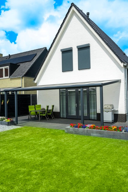 Cascina veranda in anthracite on a rendered white render finish home