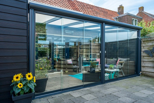 Cascina veranda in anthracite from garden, wide angle, showing full footprint