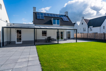 Cascina freestanding veranda in anthracite in evening light with LED on
