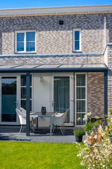 Cascina veranda in anthracite close-up showing post base and patio surface